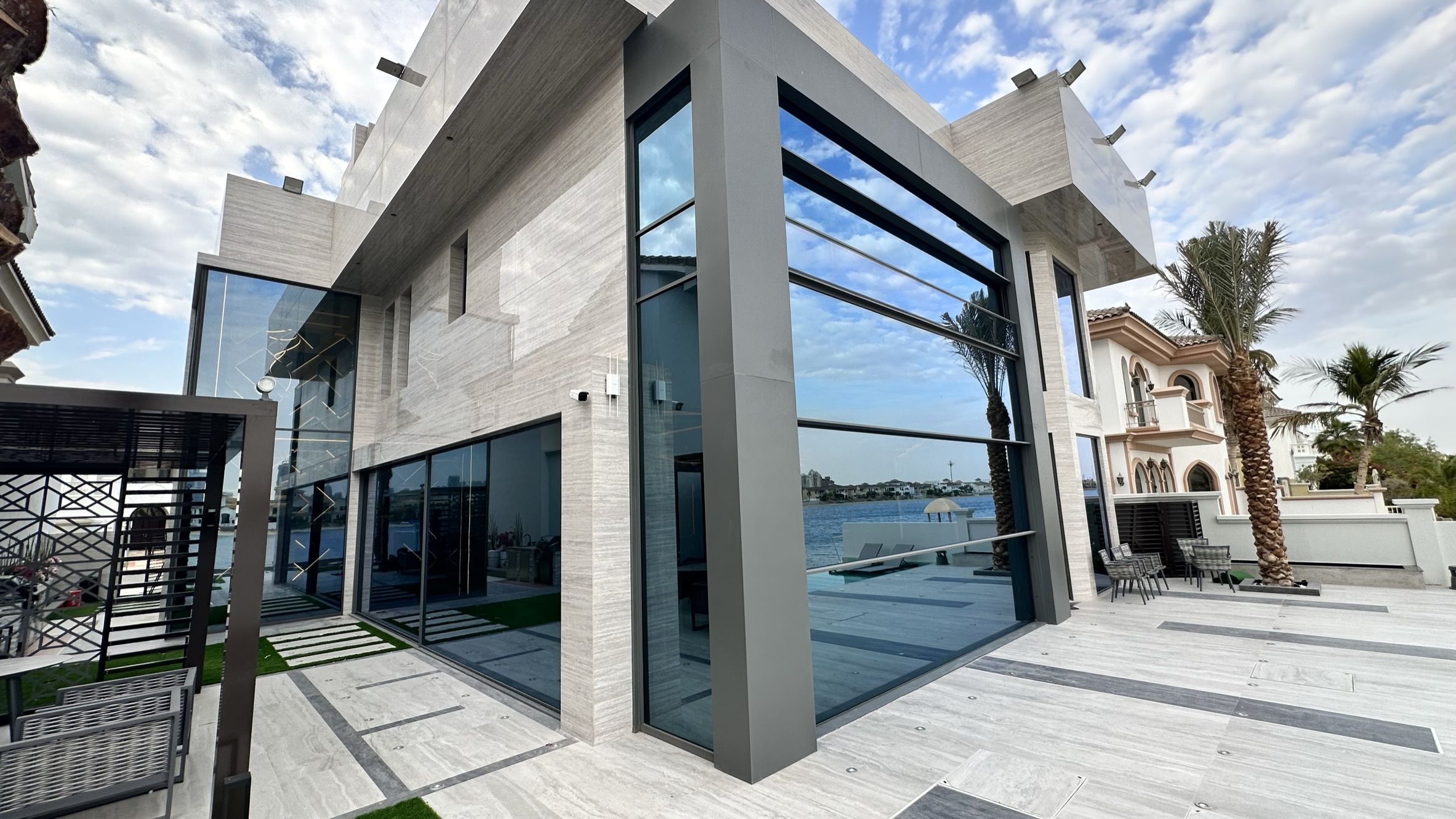 Waterfront villa with an angled glass corner