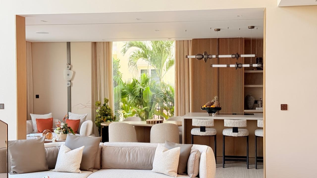 Warm living lounge opening to a garden