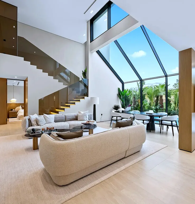 Jumeirah Islands lounge with sloped glass line and open villa interior