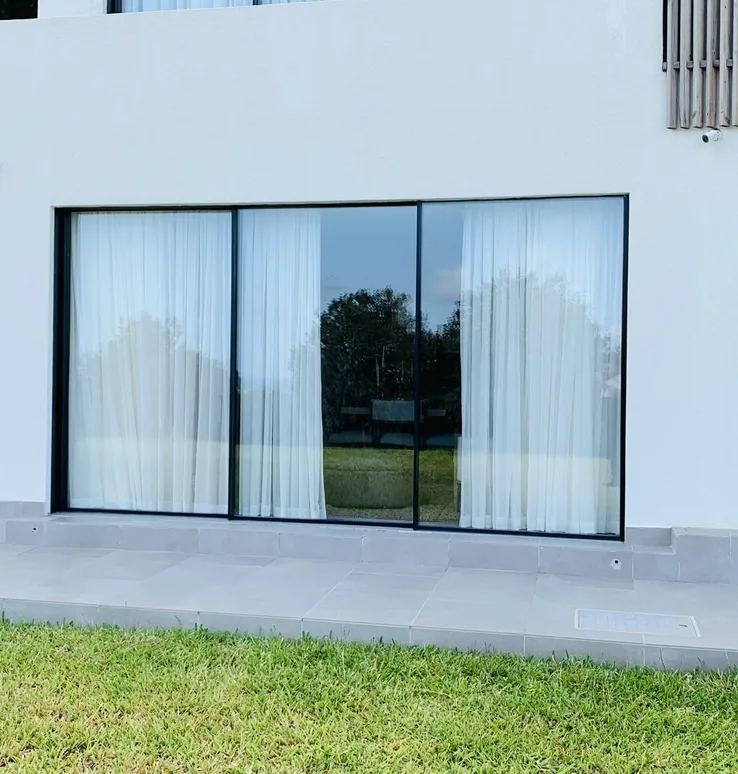 Vipingo villa ground floor glass span facing the terrace and lawn